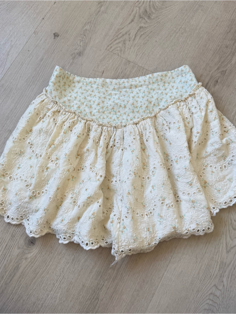 Free People off white eyelet mini skirt with floral trim